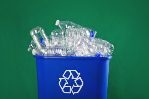 Recycling bin full of plastic water bottles.